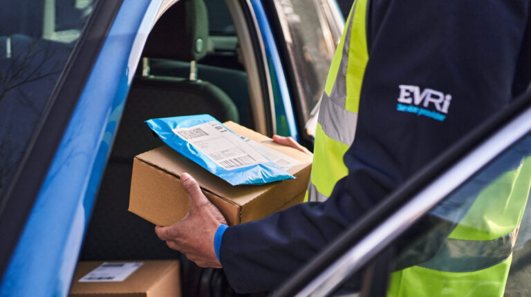 An Evri delivery worker handles a parcel.