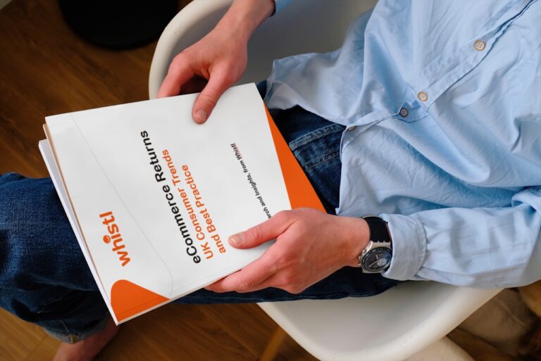 Man holding the eCommerce Returns: UK Consumer Trends and Best Practice report.