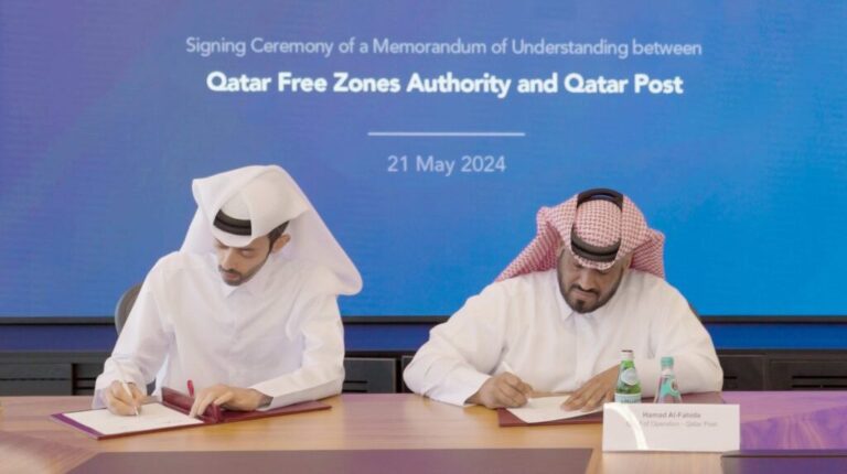 Abdulla Hamad Al Binali, director of investor relations and technical support at QFZ, and Hamad Al Fahida, chief operating officer of Qatar Post at the Business Innovation Park in Ras Bufontas Free Zone signing the MoU.