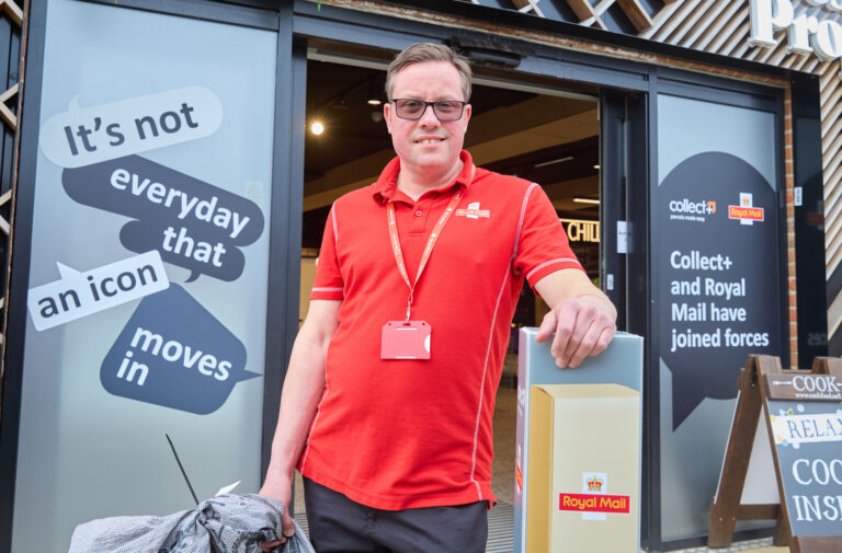Postie Martin Gilbey outside Fresh & Proper in Fordham, Cambridgeshire, one of the first stores to offer Collect+ to Royal Mail customers