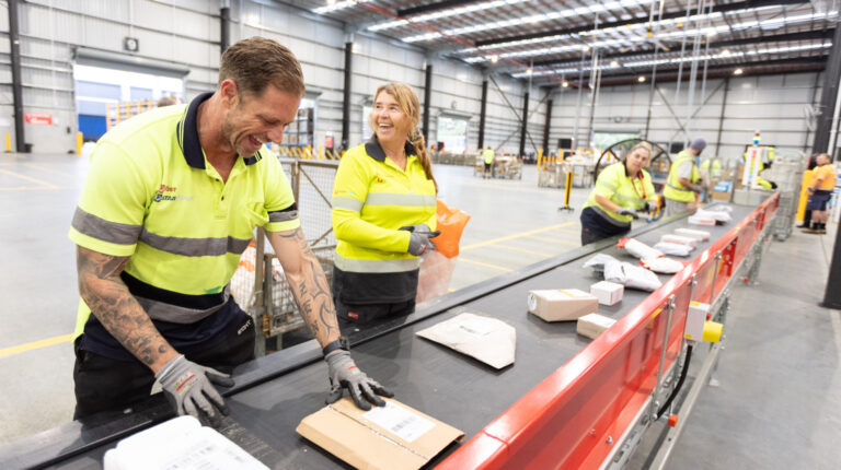 Aus Post works at the sorting line in the new Gold Cost parcel facility