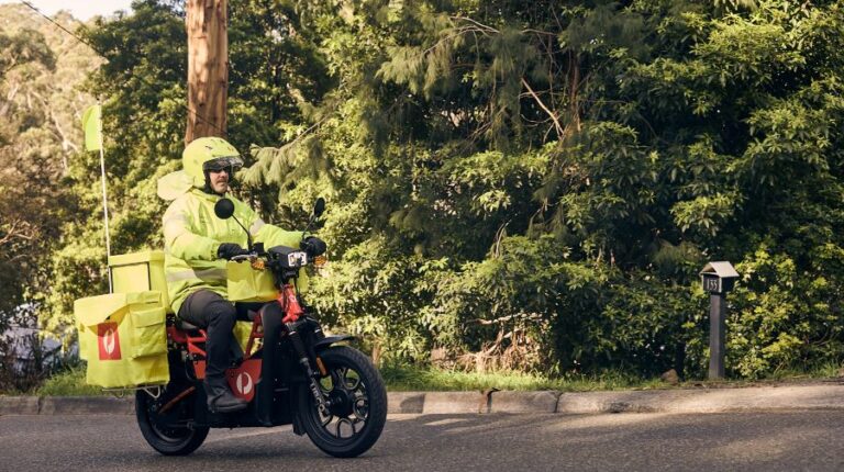 Australia Post delivery driver on the new UBCO electric motorbike.