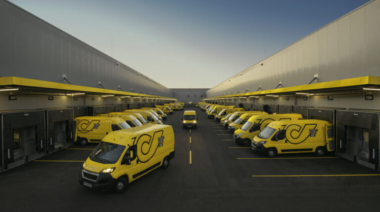 Yellow Austrian Post vans at parcel terminals