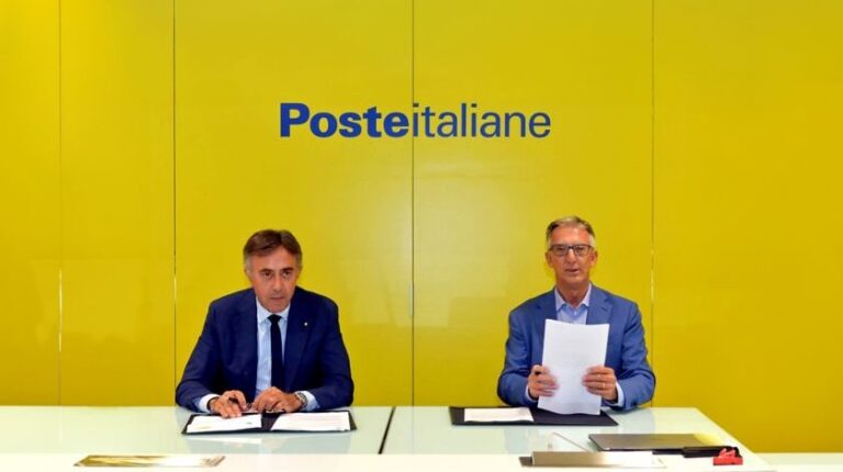 Giuseppe Lasco, general manager of Poste Italiane and Giuseppe Ricci, energy evolution chief operating officer at Eni