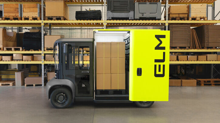 Evolv van in warehouse with yellow door open, showing brown parcels inside