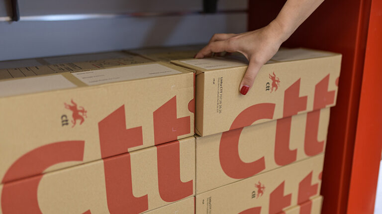 A stack of CTT – Correios de Portugal boxes