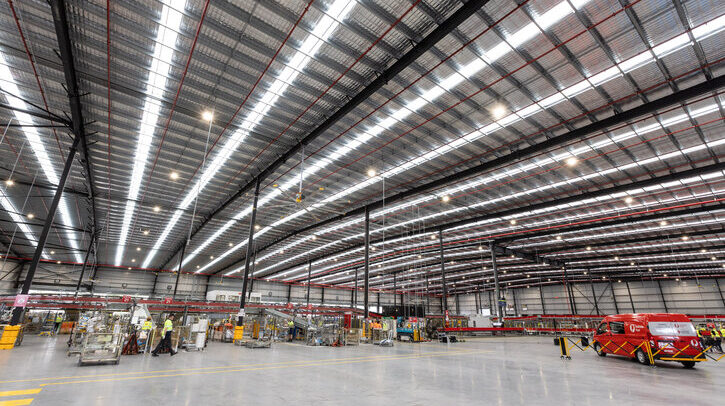 The interior or an Australia Post warehouse with sustainable lighting fixtures
