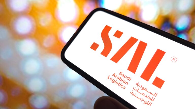 SAL company logo on a orange and white blurred background