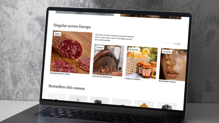 A laptop with Geopost Singular showcase platform on the screen displaying different SMEs and their products