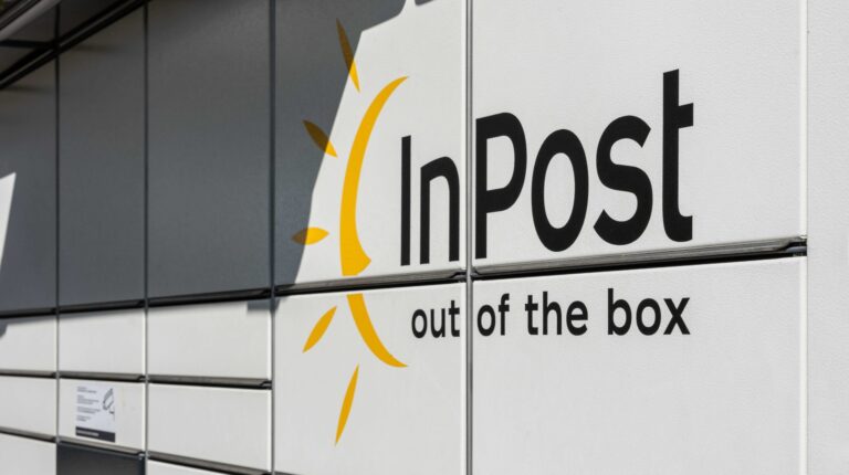 A bank of inPost lockers with the company name written in black